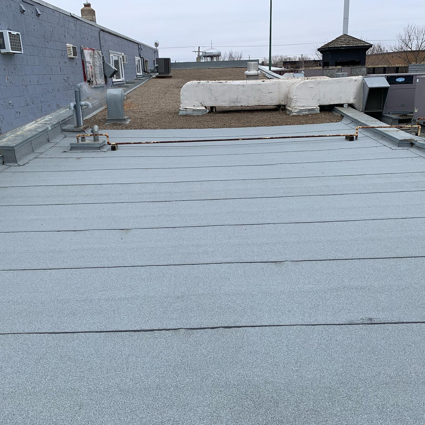 New shingled roof on a building near the Estevan highway